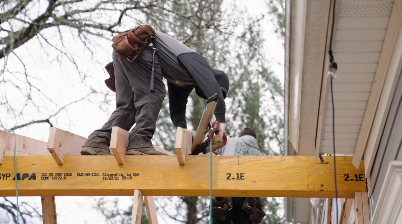 Professional sunroom construction worker installing structure in Harlingen, TX